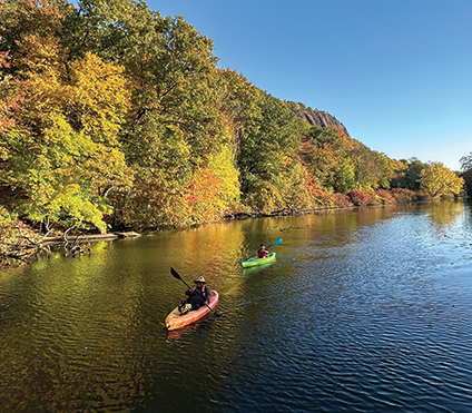 People kayaking on a river, Kathleen Cei Photo