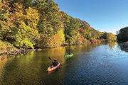 People kayaking on a river, Kathleen Cei Photo